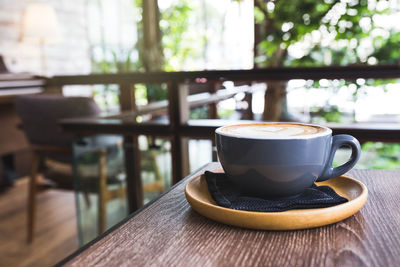 Close-up of coffee cup on table