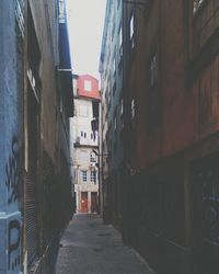 Alley amidst buildings in city