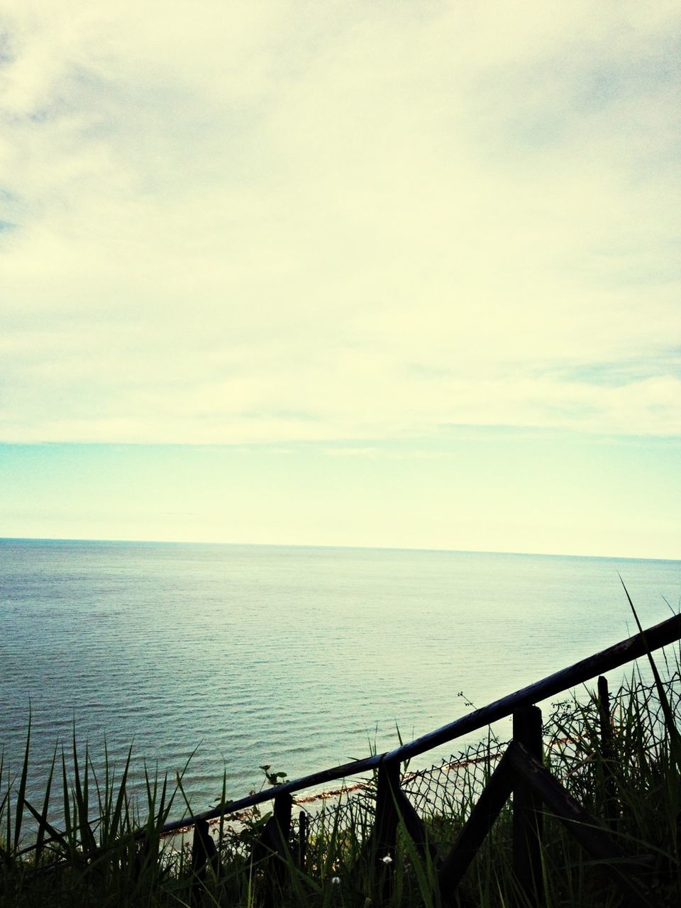 sea, horizon over water, water, sky, tranquil scene, scenics, tranquility, beauty in nature, nature, cloud - sky, railing, idyllic, cloud, seascape, blue, outdoors, cloudy, no people, day, rippled