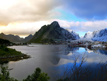 Scenic view of lake and mountains against sky