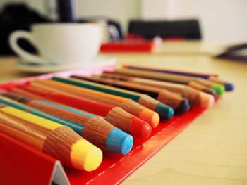 Close-up of colored pencils on table