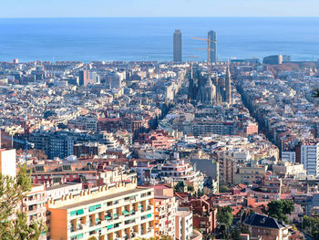 High angle view of buildings in city against sky