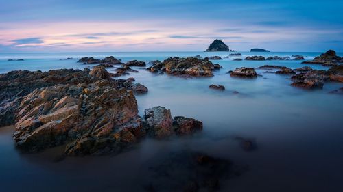 Scenic view of sea against sky at sunset
