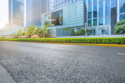 Surface level of road by buildings in city