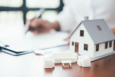 Close-up of white toy on table in house