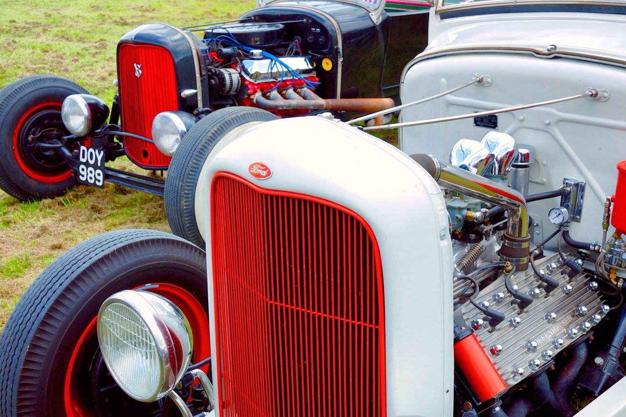 land vehicle, transportation, mode of transport, car, stationary, vintage car, vehicle part, headlight, travel, motorcycle, wheel, tire, street, part of, engine, retro styled, parked, old-fashioned, close-up, vehicle