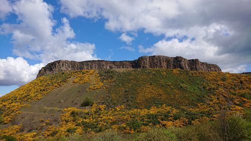 Low angle view of rock formations against sky