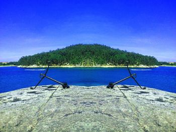 Scenic view of sea against blue sky