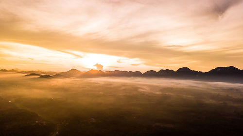 Scenic view of mountains against sky during sunset