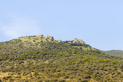 Scenic view of land against clear sky