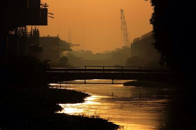 Scenic view of river at sunset