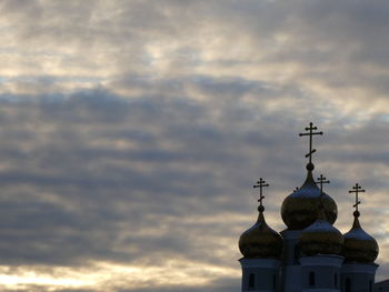Low angle view of church and building against sky