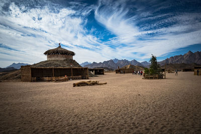 Built structure on beach against sky