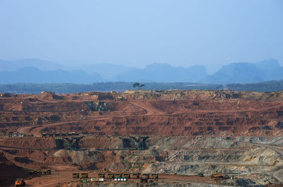 View of landscape with mountain range in background