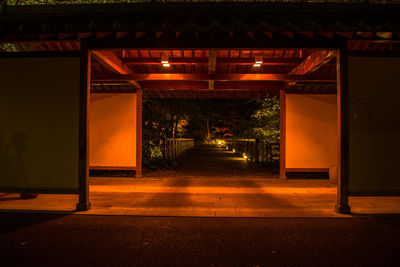 Illuminated entrance of building at night