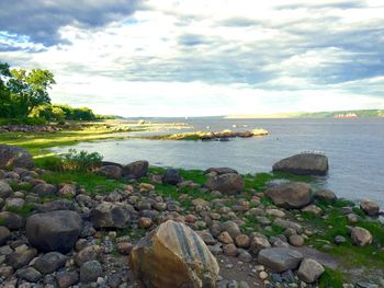 Scenic view of sea against cloudy sky