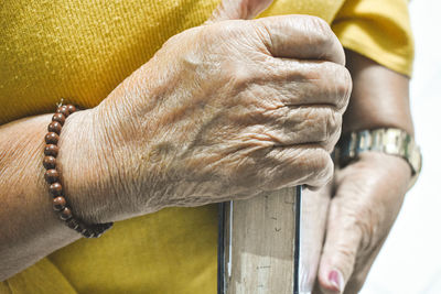 Close-up of man hand on wood