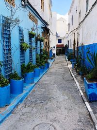 Empty alley amidst buildings in city