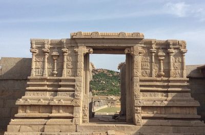 Old temple against sky in city