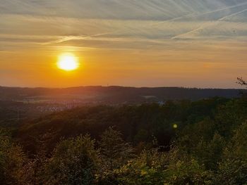 Scenic view of landscape against sky during sunset