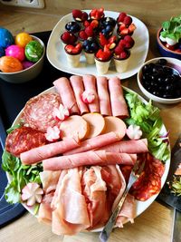 High angle view of fruits in plate on table