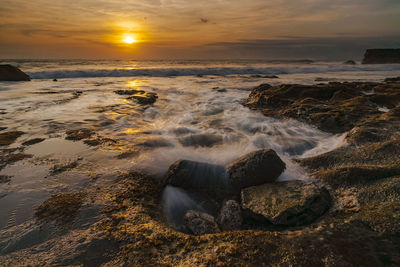 Scenic view of sea against sky during sunset