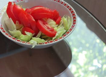 High angle view of chopped fruits in bowl on table