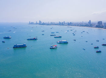High angle view of boats in sea against sky
