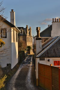 Houses against sky in city