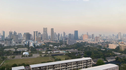 High angle view of buildings in city against sky