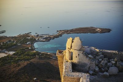 High angle view of old ruins by sea