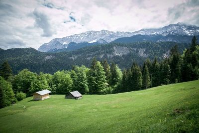 Scenic view of landscape and mountains against sky