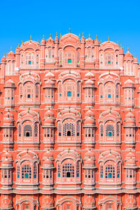 Low angle view of building against blue sky