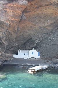 Scenic view of sea by buildings