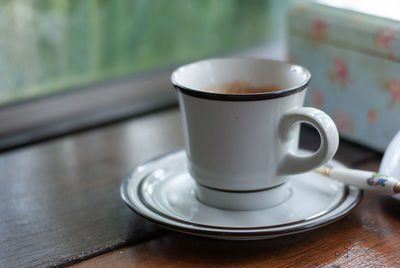 Close-up of coffee cup on table