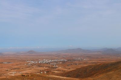 Aerial view of desert against sky