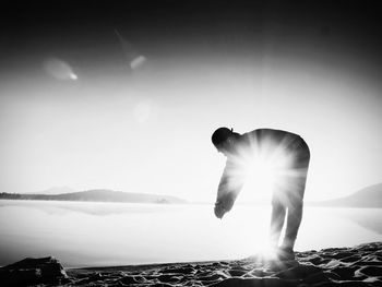 Man in sunlight against bright sun