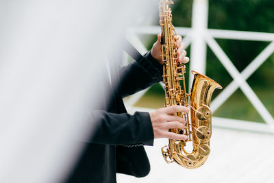 Person playing saxophone