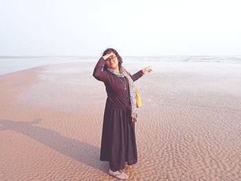 Young woman standing on beach