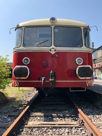 Train on railroad track against sky