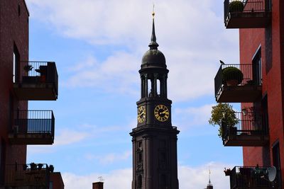 Low angle view of buildings in city against sky