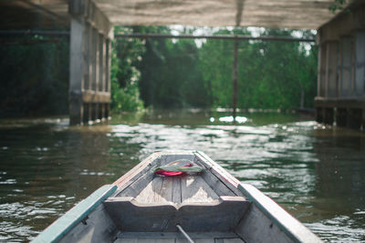 Boat in lake against trees