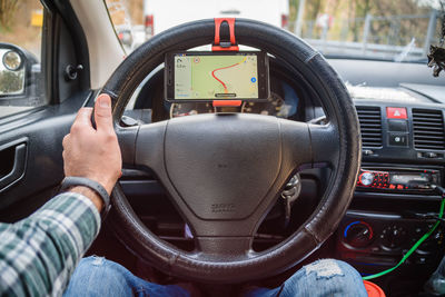 Close-up of hand holding vintage car