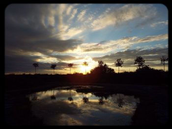 Scenic view of sunset over river