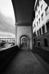 Empty alley amidst buildings in city