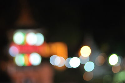 Defocused image of illuminated city at night