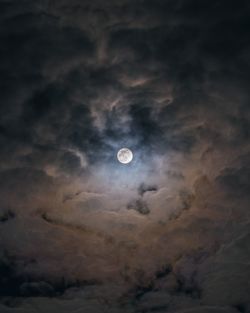 Low angle view of moon against sky at night