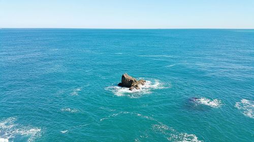 Scenic view of sea against blue sky