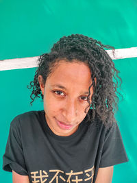 Portrait of smiling woman with curly hair