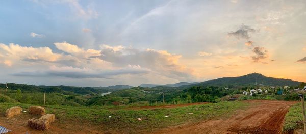 Scenic view of field against sky during sunset